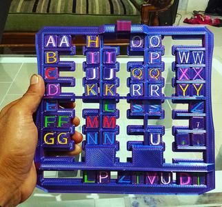 3D Printable Alphabet Slider Puzzle for Kids & DIY Projects”.