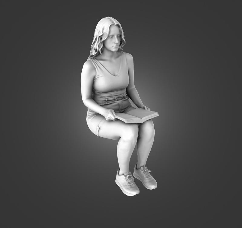 Female passenger sitting with book