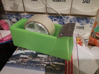 Packing tape dispenser