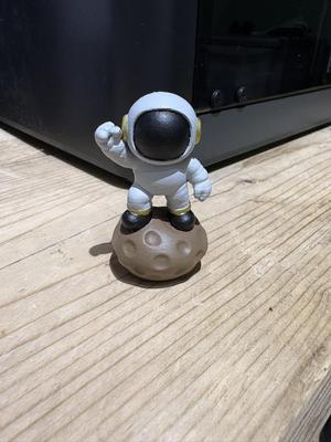 Mini Spaceman on rock fist pump