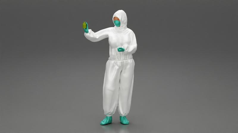 woman wearing antivirus suit standing and holding a bottle vaccin