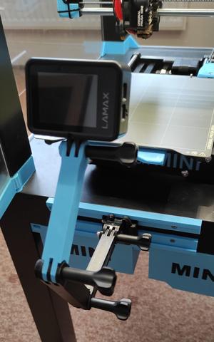 Movable action camera mount