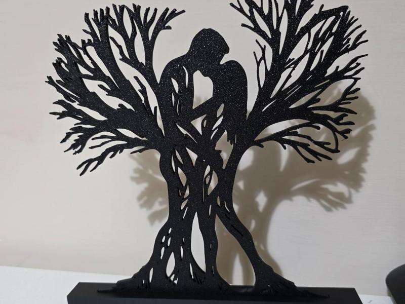 Tree silhouettes with romantic couple
