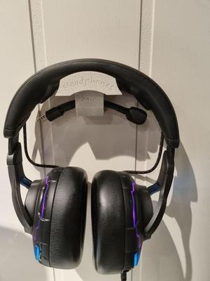 Slim wall mount for headphones, with detachable mic holder.