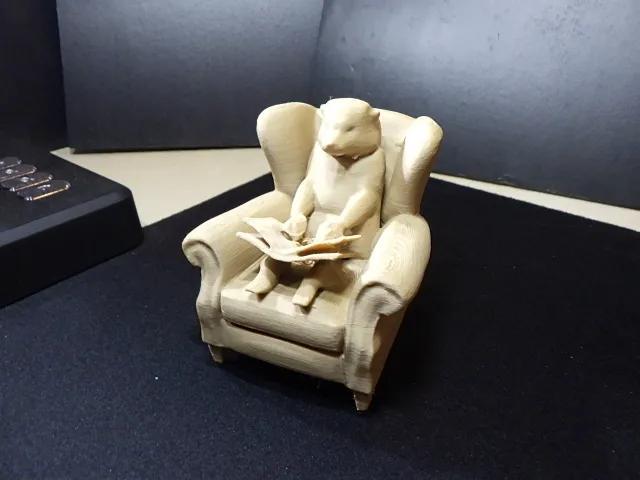 Otter in a Chair Reading.   