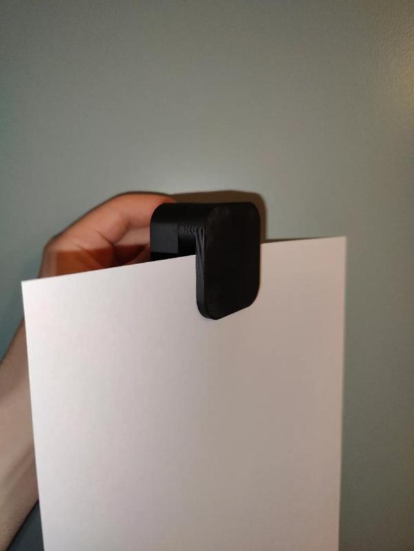 Gravity paper holder