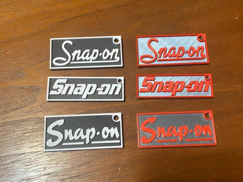 Snap-on keychains present—vintage logo