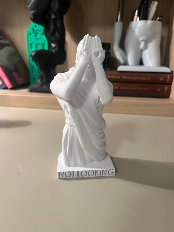 “Not Looking” Voyeur Jesus Statue – Unique and Humorous Design