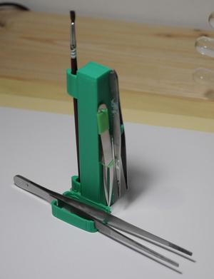 Tweezer and brush holder