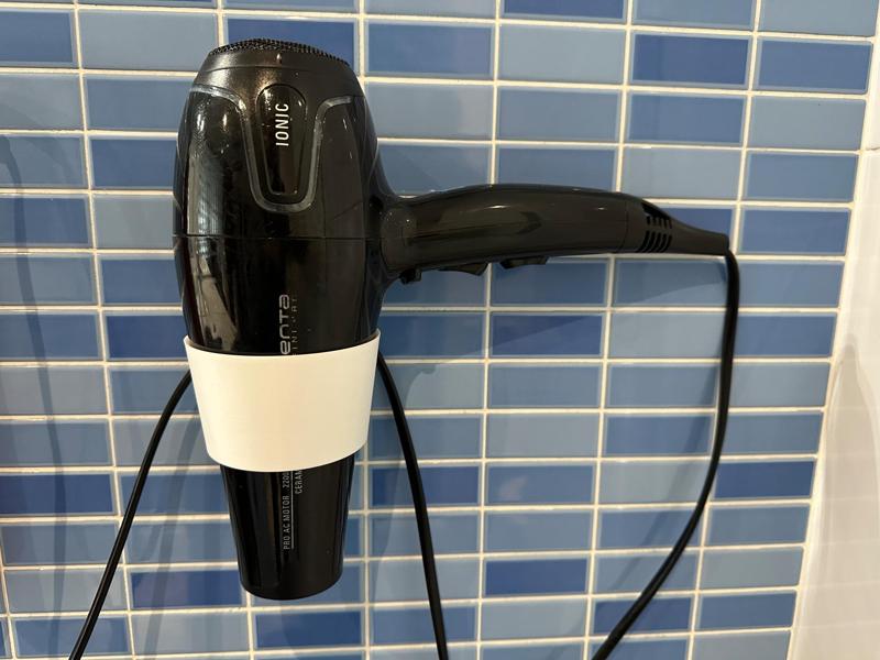 Hair dryer wall mount. / Support de paret per a secador de cabell.