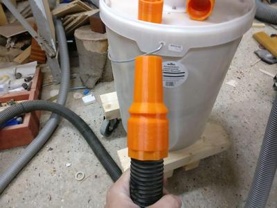 Rotating vacuum hose nozzle - print in place