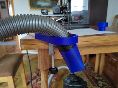 Holder for vacuum cleaner hose   