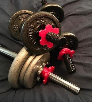 Retaining nut for barbell or dumbell weight