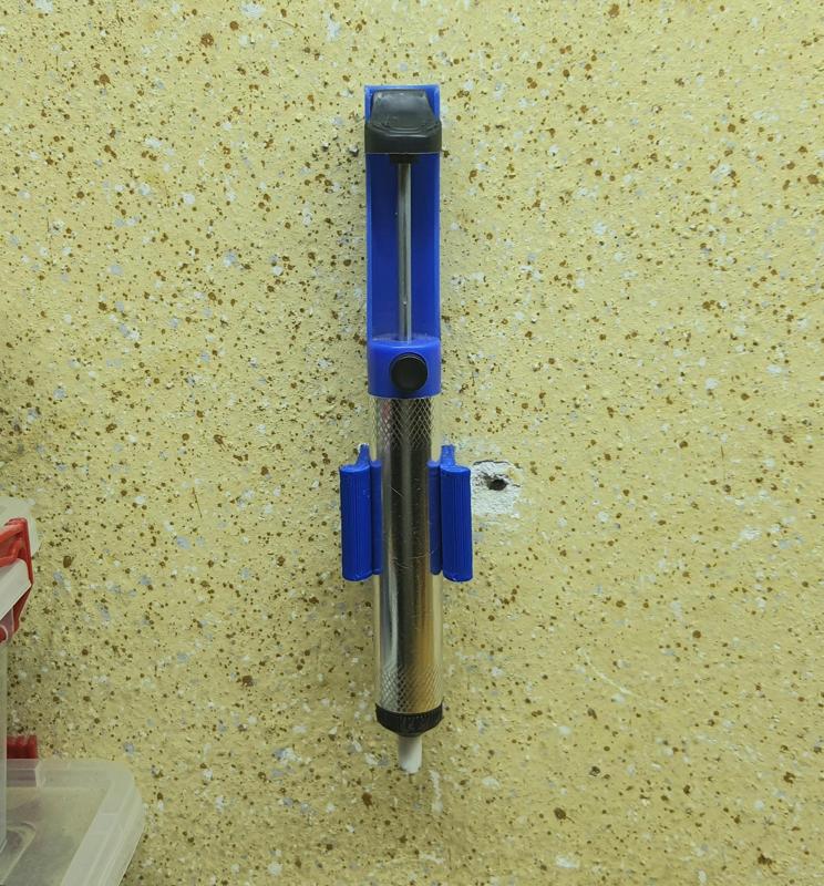 Solder pump wall mount