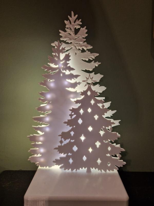 Three Christmas Trees with LED string decoration