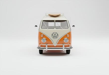 Classic Orange and White Volkswagen Bus with Surfboard