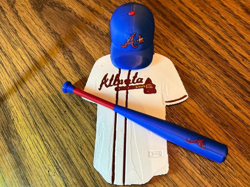 Atlanta Braves Jersey, a hat, and a bat