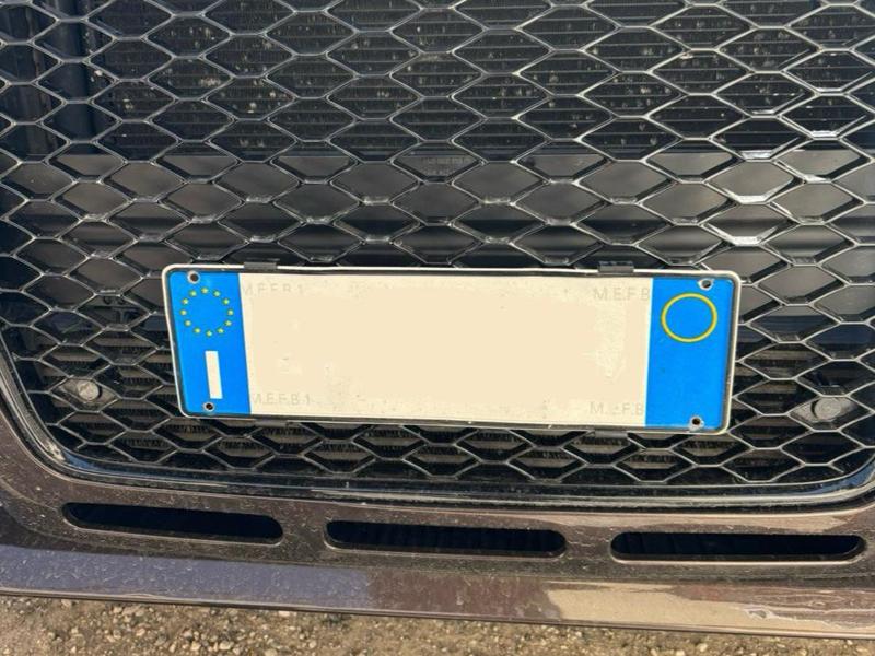 Audi honeycomb grille license plate support