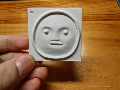 unhappy poker face keychain