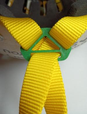 Triangular temple adjustment buckle for sports helmet