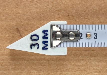 Nozzle on a tape measure for measurement of angles.
