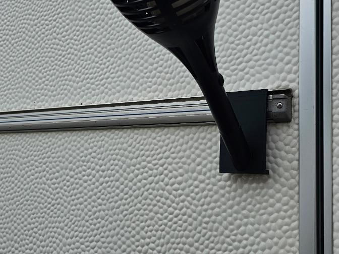 Grommet-mounted torch holder