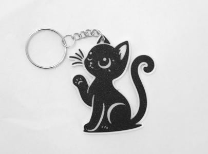 Keychain . Cat with paw in the air