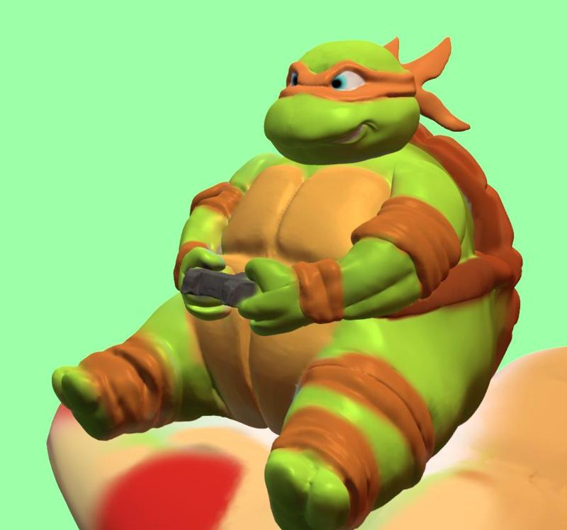 miguel angelo sitting on a slice of pizza while playing video games