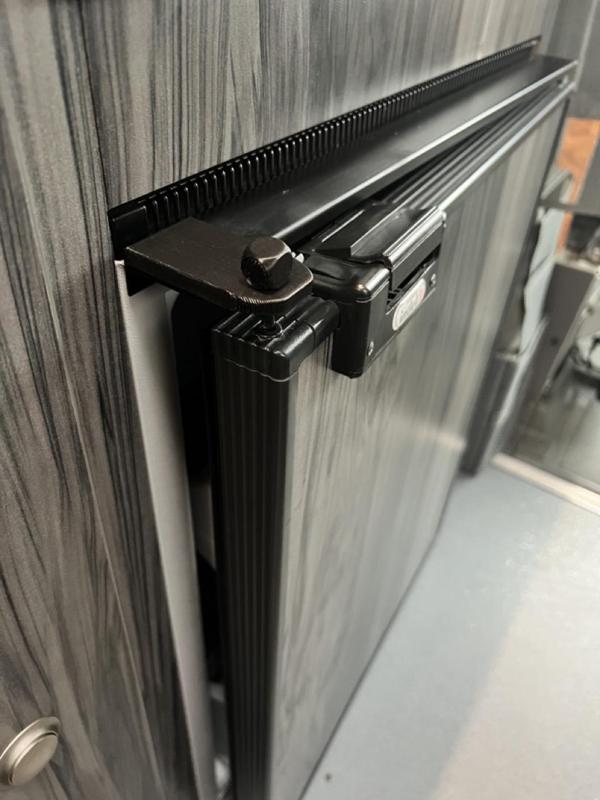 RV fridge door open holder