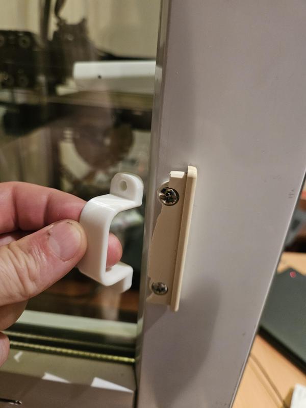 Mini handle for a metal-plastic balcony door