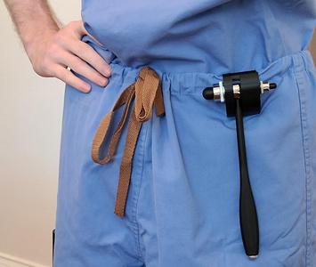Reflex hammer belt clip/holster