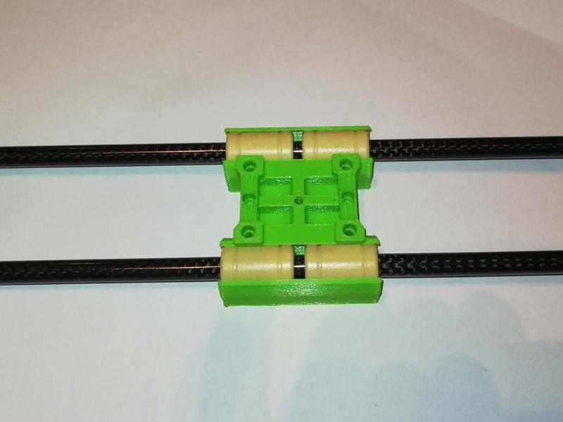 Modified X carriage for Hypercube using carbon fiber X axis and RJMP-01-08 plastic linear bearings