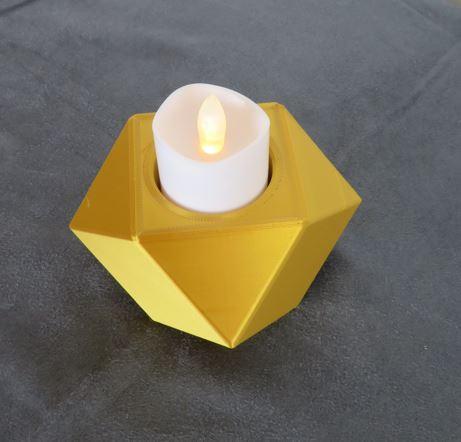 Symmetrical candle holder for tea lights