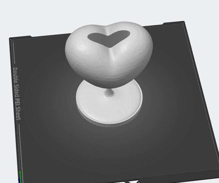 Heart statue with vase