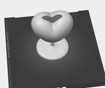 Heart statue with vase