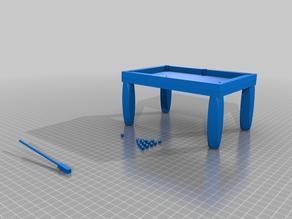 Pool Table with Billiard Balls, Cue Ball, and a Cue Stick