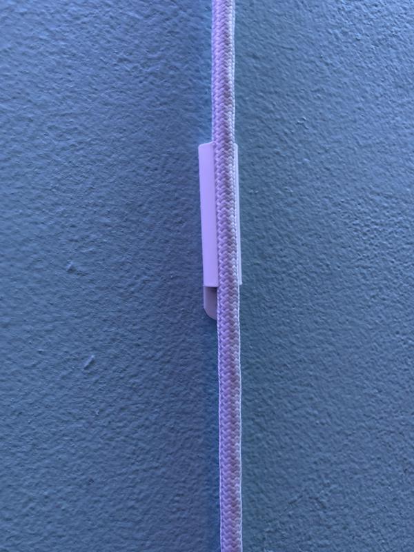 Cord holder for round extension cord