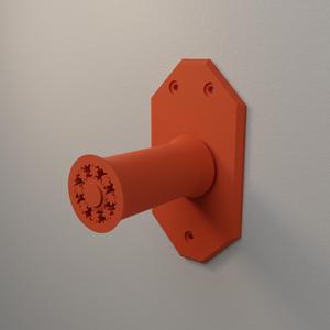Wall mounted rolling spool holder.