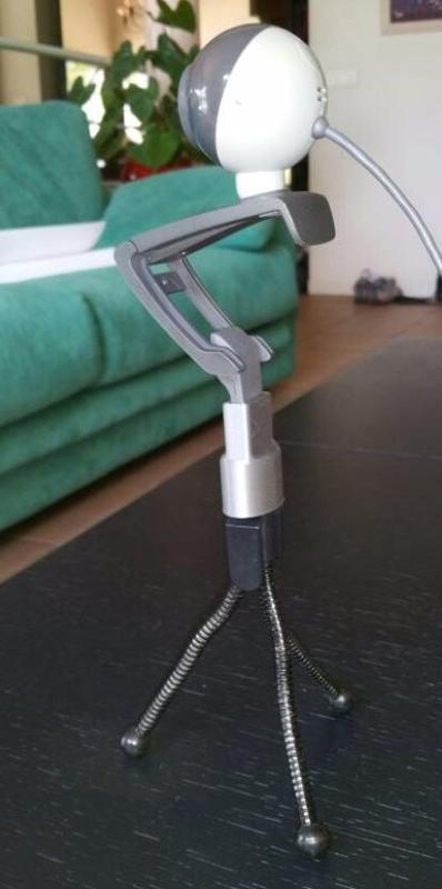 Logitech webcam holder.