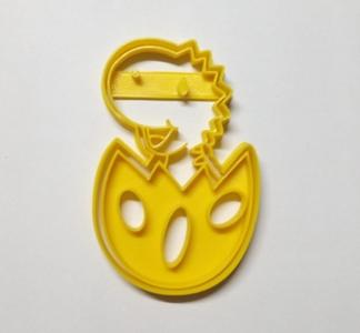 Dinosaur Breaking an Egg Cutter and Marker