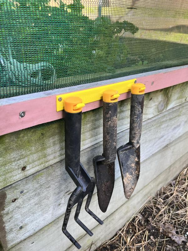 Hooks to hold Fiskars hand gardening tools