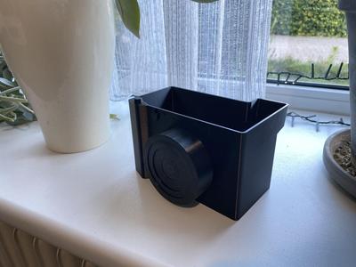 Camera flower pot with water indicator