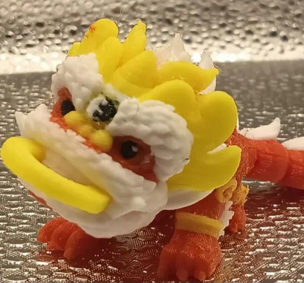 Adorable short-tailed lion dance head with gold coin pendant