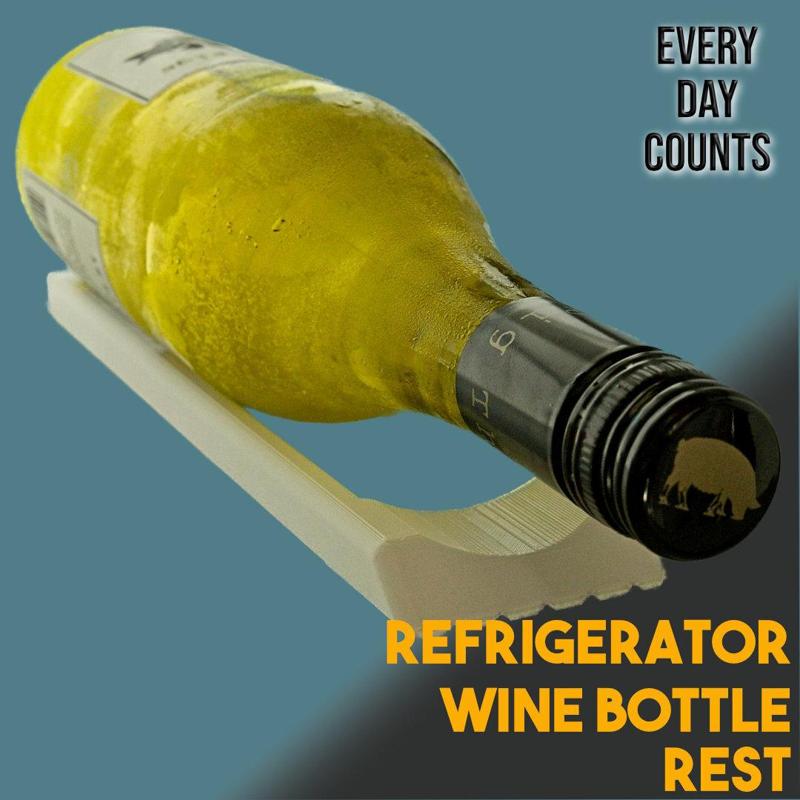Refrigerator wine bottle rest
