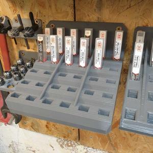 Wall mounted bracket for small tooling in packaging (rectangular cross-section)