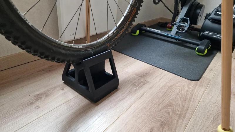Indoor trainer front wheel raiser   