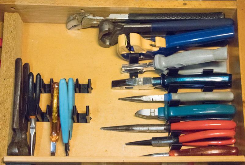 Organizer for pliers in a drawer