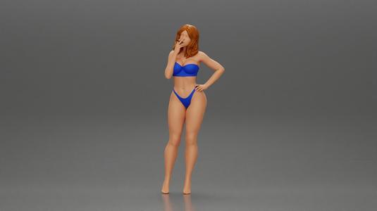 sexy girl in bikini standing smoking cigarette on the beach
