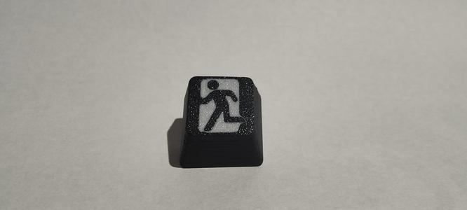 Escape key with inlay