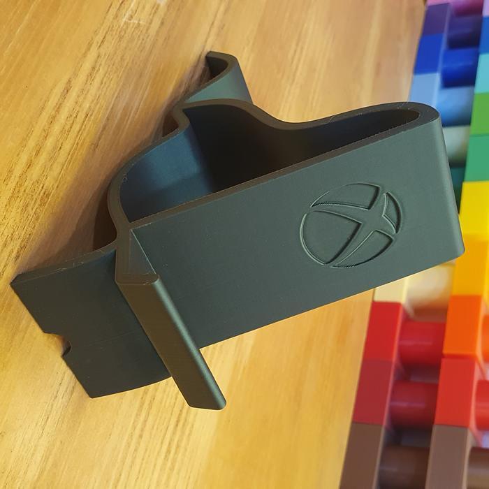 Soporte de telefono con el logo de Xbox